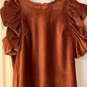 Rust color ribbed puff sleeve Tshirt.